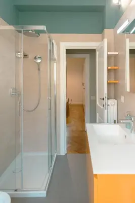 a bathroom with a shower and a sink at Tiber Luxury Apartment in Rome