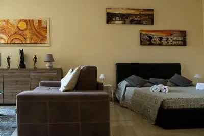 a living room with a couch and a table at Spanish Steps Studio in Rome