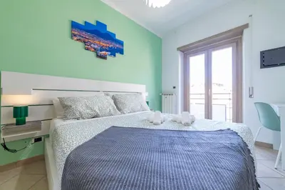 a bedroom with a bed with two teddy bears on it at Bubu's Home by Holiday World in Rome