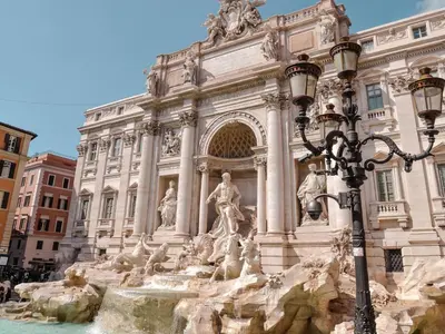 a building with a fountain in front of it at Bubu's Home by Holiday World in Rome