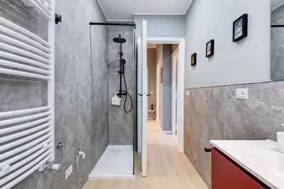 a bathroom with a shower and a sink at Domus Suite Gemelli - Relax & Comfort in Rome