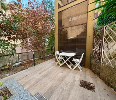 a table and two chairs sitting on a patio at Vatican Walls Studio in Rome