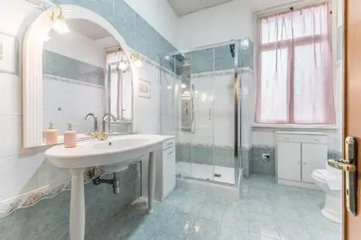 a bathroom with a sink and a shower at Dimora Armanda Roma in Rome