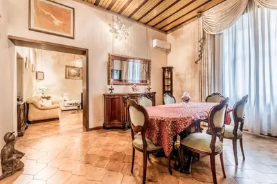 a dining room with a table and chairs at Dimora Armanda Roma in Rome