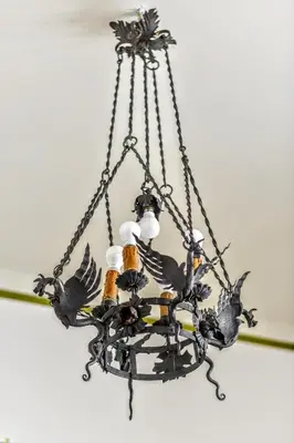 a metal chandelier with birds on it at Casa Arpinelli in Rome