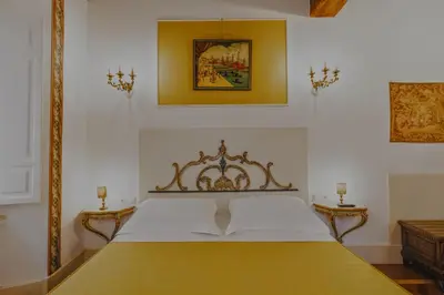 a bedroom with a large bed in a room at Casa Arpinelli in Rome