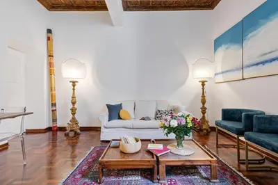 a living room with a couch and a table at Rome as you feel - Vetrina Terrace in Rome