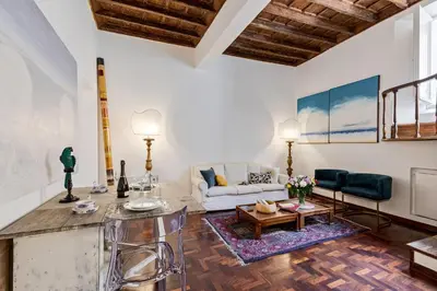 a living room with a couch and a table at Rome as you feel - Vetrina Terrace in Rome