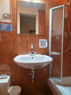 a bathroom with a sink and a shower and a toilet at Chez Oriana Termini St in Rome