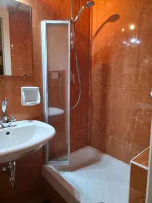 a bathroom with a shower and a sink at Chez Oriana Termini St in Rome