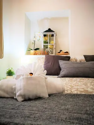 a bedroom with a bed with a white blanket at Have A Nice Holiday - Luxury Rooms in Rome