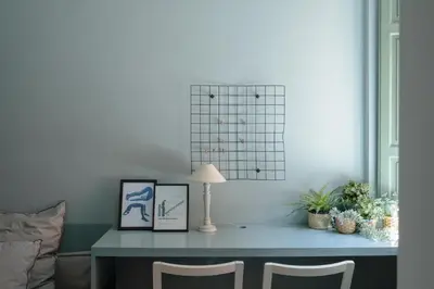 a table with two chairs and a lamp on it at Emanuela Home - VATICAN in Rome