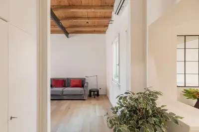 a living room with a couch in the middle at iFlat Peaceful & Charming Hideaway near Vatican in Rome