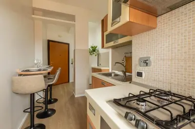 a kitchen with a stove and a counter top at LA PETITE MAISON a ROME in Rome