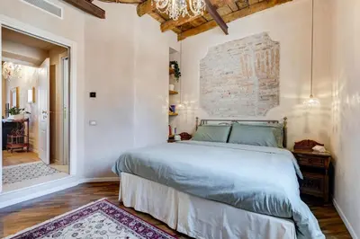 a bedroom with a large bed in a room at Mazza Stay in Rome