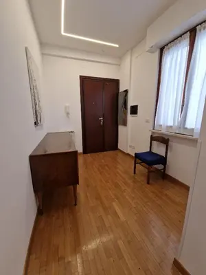 an empty room with a desk and a chair at Ponte Lungo Guest House in Rome