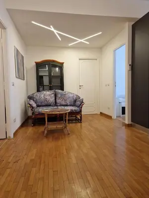 a living room with a couch and a table at Ponte Lungo Guest House in Rome