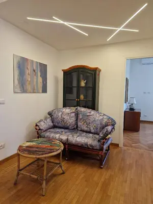 a living room with a couch and a table at Ponte Lungo Guest House in Rome