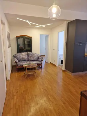 a living room with a couch and a table at Ponte Lungo Guest House in Rome