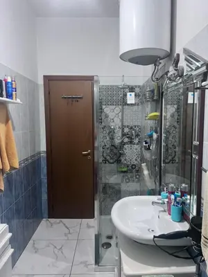 a bathroom with a sink and a shower at Na Notte a Roma in Rome