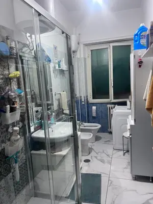 a bathroom with a shower and a sink and a toilet at Na Notte a Roma in Rome