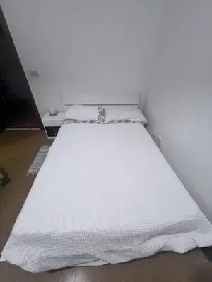 a large white bed in a room at Na Notte a Roma in Rome