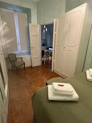 a bedroom with two beds with towels on top of it at Casa Luciano in Rome