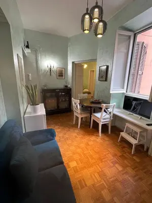 a living room with a couch and a table at Casa Luciano in Rome