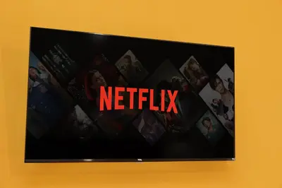 a television screen with the netflix sign on a wall at Michele Lux Lodge 6 people Spotless and Connected to Airport and Vatican in Rome