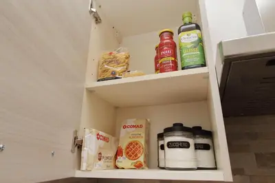 a cabinet with food and drinks in it at Michele Lux Lodge 6 people Spotless and Connected to Airport and Vatican in Rome