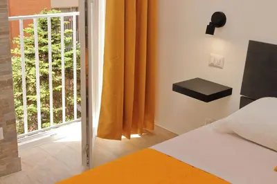 a bedroom with a bed and a large window at Michele Lux Lodge 6 people Spotless and Connected to Airport and Vatican in Rome
