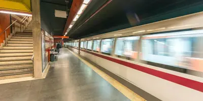 a train is speeding through a subway station at Trinita' dei Monti, night check-in also available in Rome