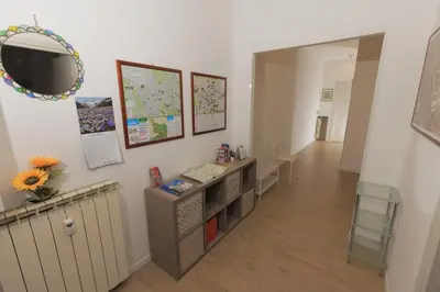 a hallway with a desk and a mirror on a wall at Trinita' dei Monti, night check-in also available in Rome