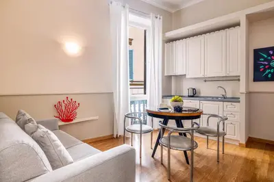 a living room with a couch and a table at Navona Boutique House in Rome