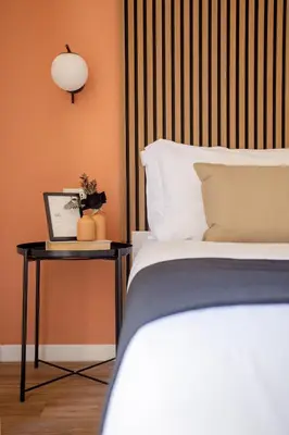a bedroom with a bed and a table with a laptop at Porta Pia Stay GuestHouse in Rome