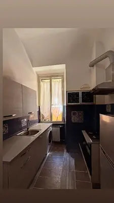 a kitchen with a sink and a window at Suncity Sweet Home in Rome