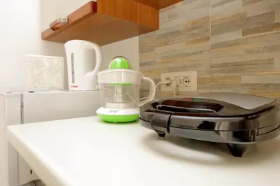 a blender sitting on top of a kitchen counter at Castro Pretorio Sweet Home in Rome