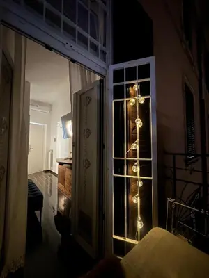 a room with a window with christmas lights on it at Sanctus Michael Archangelus in Rome