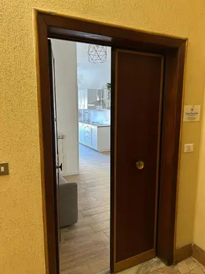an open door to a room with a kitchen at Casa Susanna in Rome