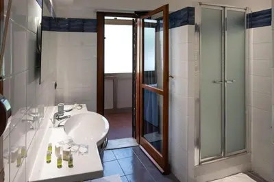 a bathroom with a sink and a shower at Residenza in Vaticano Roma in Rome