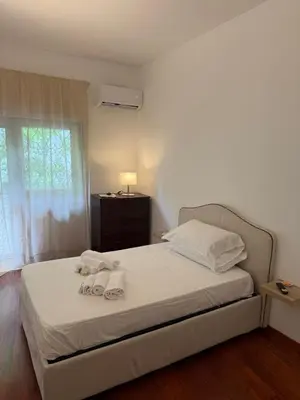 a bedroom with a bed with towels on it at Residenza in Vaticano Roma in Rome