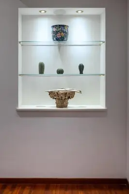 a shelf with a vase on a wall at Residenza in Vaticano Roma in Rome