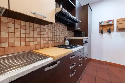 a kitchen with a stove and a counter top at Number Five Apartment in Trastevere in Rome