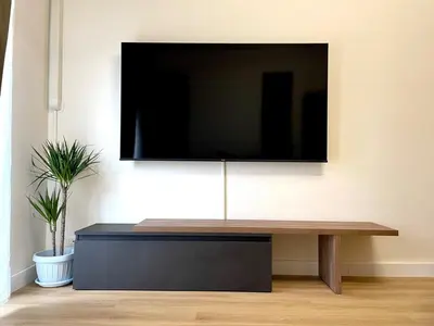a living room with a tv on a wall at LH Vatican Museum Wi-Fi AC Flat Premium Comfort in Rome