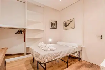 a white room with a bed in a room at Green Loft di Trastevere in Rome