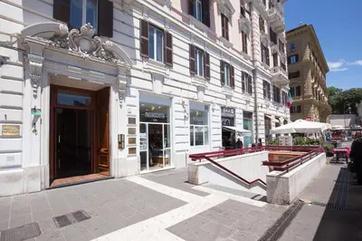 a building on a city street with a building at Relais Piazza Del Popolo in Rome