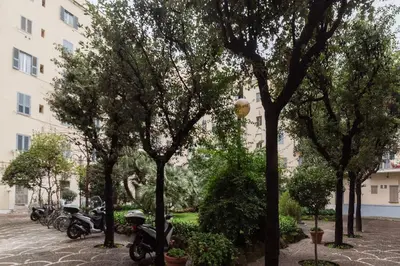 a row of motorcycles parked next to a building at Leone IV - WelcomeToRhome in Rome