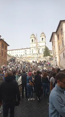a large crowd of people standing in front of a building at Loft Lomelina, Roma, Metro Bologna Colosseo in Rome