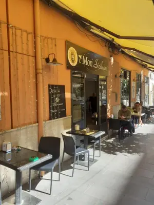 a restaurant with tables and chairs in front of a building at Loft Lomelina, Roma, Metro Bologna Colosseo in Rome