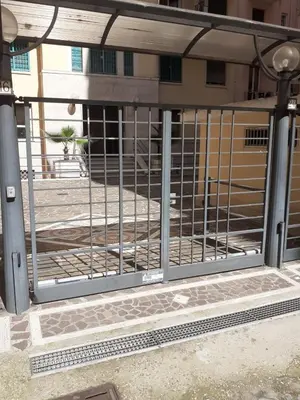 a gate in front of a building at Loft Lomelina, Roma, Metro Bologna Colosseo in Rome